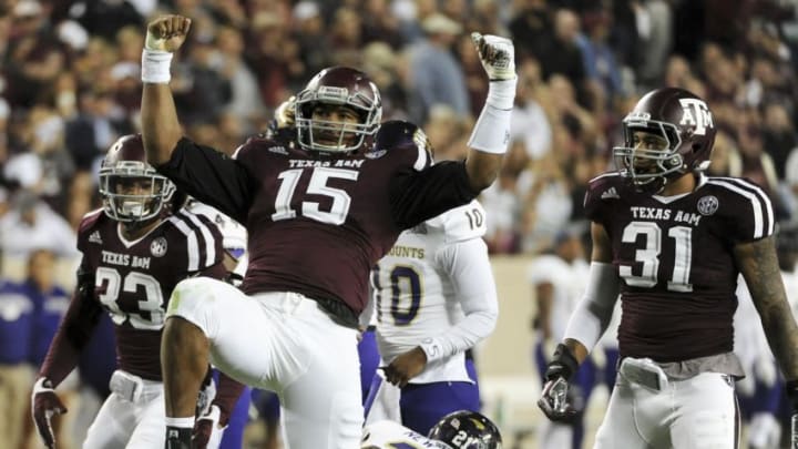 COLLEGE STATION, TX - NOVEMBER 14: Myles Garrett #15 of the Texas A&M Aggies celebrates his tackle of Detrez Newsome #21 of the Western Carolina Catamounts in the first quarter of a NCAA football game at Kyle Field on November 14, 2015 in College Station, Texas. (Photo by Eric Christian Smith/Getty Images)
