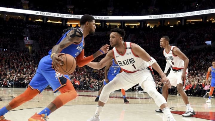 NBA DFS: PORTLAND, OR - APRIL 14: Paul George #13 of the Oklahoma City Thunder drives to the basket on Evan Turner #1 of the Portland Trail Blazers during the second half of the game at the Moda Center on April 14, 2019 in Portland, Oregon. The Blazers won 104-99. NOTE TO USER: User expressly acknowledges and agrees that, by downloading and or using this photograph, User is consenting to the terms and conditions of the Getty Images License Agreement. (Photo by Steve Dykes/Getty Images)