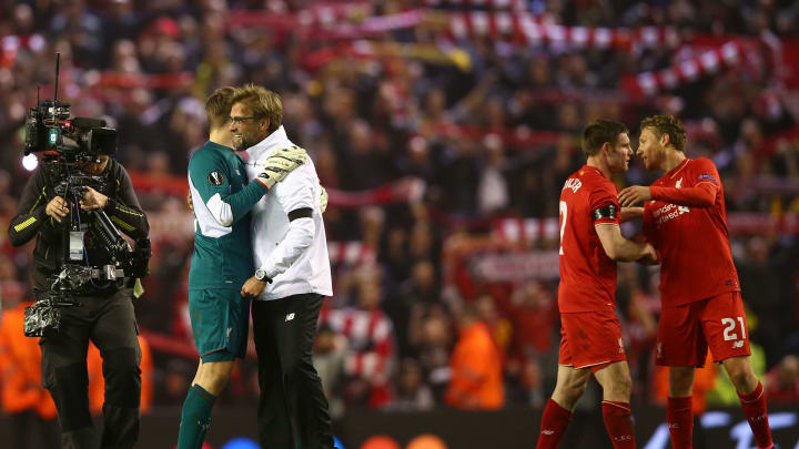 LIVERPOOL, ENGLAND – APRIL 14: Jurgen Klopp, manager of Liverpool celebrates victory with Simon Mignolet after the UEFA Europa League quarter final, second leg match between Liverpool and Borussia Dortmund at Anfield on April 14, 2016 in Liverpool, United Kingdom. (Photo by Clive Brunskill/Getty Images)