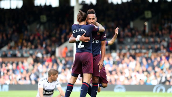 LONDON, ENGLAND - OCTOBER 07: Pierre-Emerick Aubameyang of Arsenal celebrates with teammate Hector Bellerin after scoring his team's fifth goal during the Premier League match between Fulham FC and Arsenal FC at Craven Cottage on October 7, 2018 in London, United Kingdom. (Photo by Catherine Ivill/Getty Images)