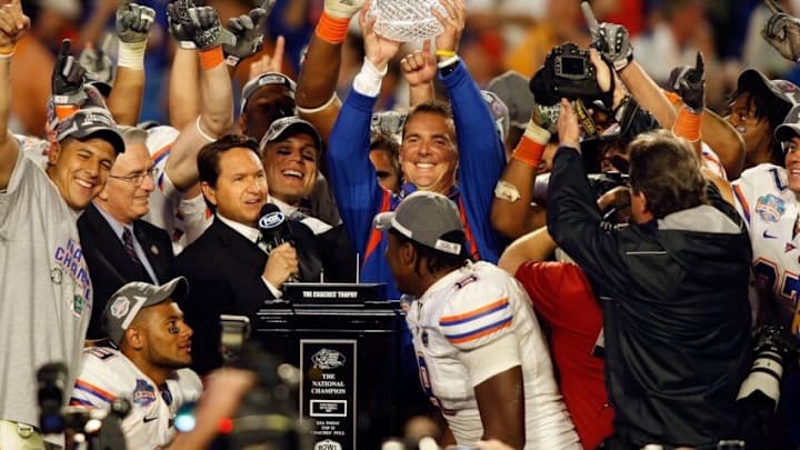 MIAMI - JANUARY 08: Head coach Urban Meyer of the Florida Gators holds the championship trophy at the podium following the game against the Oklahoma Sooners at the FedEx BCS National Championship Game at Dolphin Stadium on January 8, 2009 in Miami, Florida. (Photo by J. Meric/Getty Images)