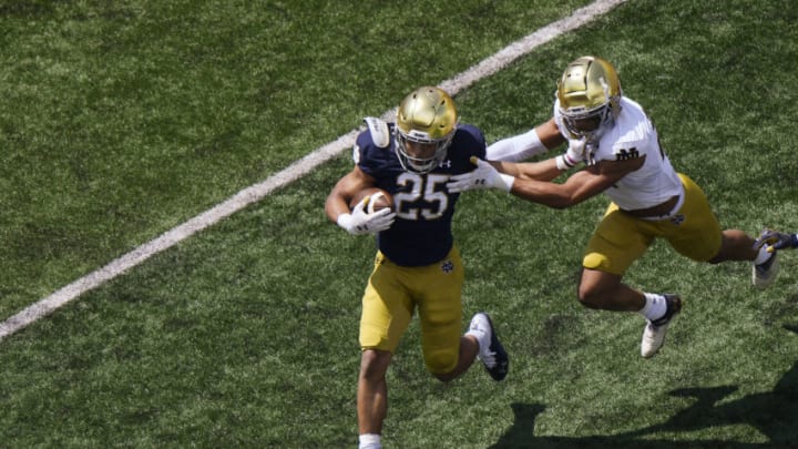 SOUTH BEND, INDIANA - MAY 01: Chris Tyree #25 of the Notre Dame Fighting Irish runs the football in the first half of the Blue-Gold Spring Game at Notre Dame Stadium on May 01, 2021 in South Bend, Indiana. (Photo by Quinn Harris/Getty Images)