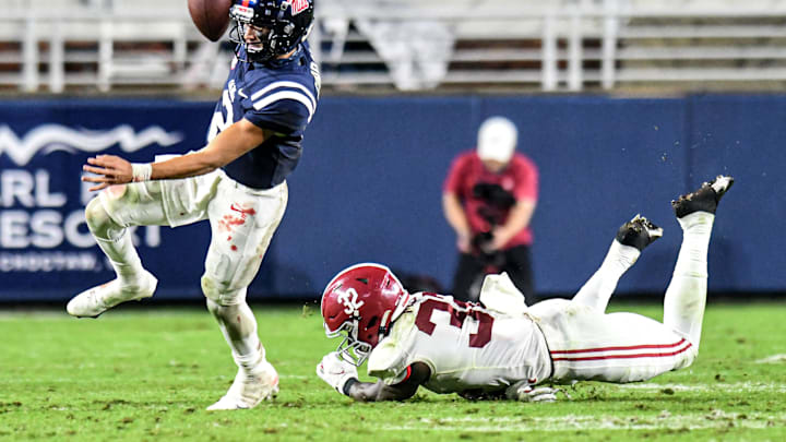 Oct 10, 2020; Oxford, MX, USA; Ole Miss quarterback Matt Corral (2) avoids Alabama linebacker Dylan Moses (32) at Vaught-Hemingway Stadium. Mandatory Credit: Bruce Newman via USA TODAY Sports