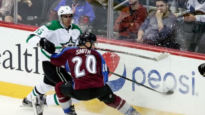 Oct 15, 2016; Denver, CO, USA; Colorado Avalanche right wing Ben Smith (20) and Dallas Stars defenseman Patrik Nemeth (15) battle for the puck in the second period at the Pepsi Center. Mandatory Credit: Isaiah J. Downing-USA TODAY Sports