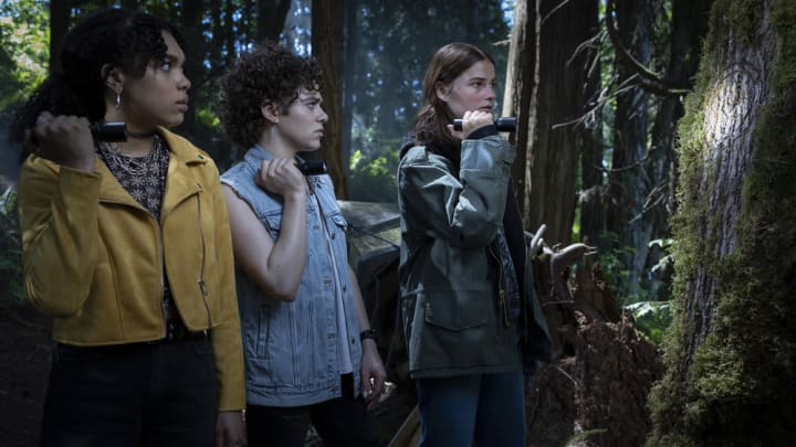 THE GIRL IN THE WOODS — “The Guardian” Episode 101 — Pictured: (l-r) Sofia Bryant as Tasha Gibson, Misha Osherovich as Nolan Frisk, Stefanie Scott as Carrie Ecker — (Photo by: Scott Green/Peacock)