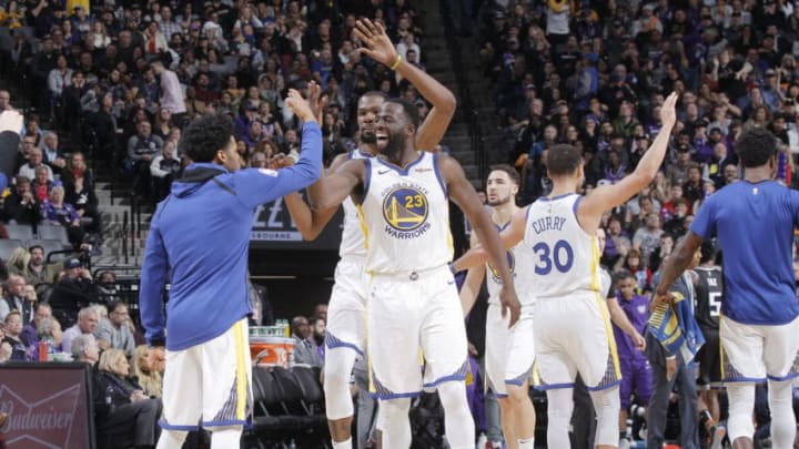 SACRAMENTO, CA - JANUARY 5: Quinn Cook #4 and Draymond Green #23 of the Golden State Warriors high five against the Sacramento Kings on January 5, 2019 at Golden 1 Center in Sacramento, California. NOTE TO USER: User expressly acknowledges and agrees that, by downloading and or using this Photograph, user is consenting to the terms and conditions of the Getty Images License Agreement. Mandatory Copyright Notice: Copyright 2019 NBAE (Photo by Rocky Widner/NBAE via Getty Images)