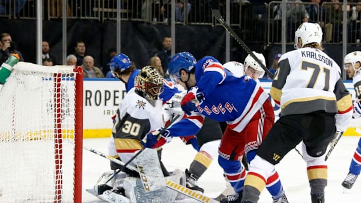 NEW YORK, NY - DECEMBER 02: Adam Fox #23 of the New York Rangers battles for the puck as Malcolm Subban #30 of the Vegas Golden Knights makes a save at Madison Square Garden on December 2, 2019 in New York City. (Photo by Jared Silber/NHLI via Getty Images)