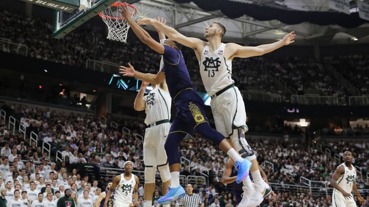 EAST LANSING, MI – NOVEMBER 30: Bonzie Colson #35 of the Notre Dame Fighting Irish shoots a lay up against Gavin Schilling #34 of the Michigan State Spartans at Breslin Center on November 30, 2017 in East Lansing, Michigan. (Photo by Rey Del Rio/Getty Images)