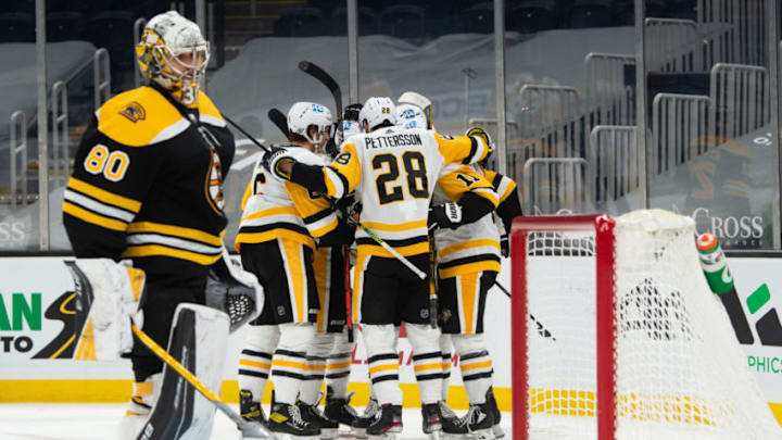 Apr 1, 2021; Boston, Massachusetts, USA; Pittsburgh Penguins defenseman Marcus Pettrsson (28) celebrates with teammates after Zach Aston-Reese (12) scored a goal against the Boston Bruins in the second period at TD Garden. Mandatory Credit: Kathryn Riley-USA TODAY Sports