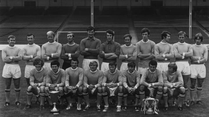 20th August 1970: Manchester City Football Club, the winners of the League Cup and the European Cup Winners Cup, (left to right), back row, D Connor, Glyn Pardoe, George Heslop, Henry Dowd, Joe Corrigan, Ken Mulhearn, Arthur Mann, Tommy Booth, Mike Doyle, Alan Oakes and D Jeffries. Front row, Ian Bowyer, Fred Hill, Mike Summerbee, Francis Lee, Tony Book, Frank Carrodus, Neil Young and Colin Bell. (Photo by Central Press/Getty Images)