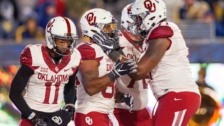 Nov 19, 2016; Morgantown, WV, USA; Oklahoma Sooners running back Samaje Perine (32) celebrates with teammates after scoring a touchdown during the second quarter against the West Virginia Mountaineers at Milan Puskar Stadium. Mandatory Credit: Ben Queen-USA TODAY Sports