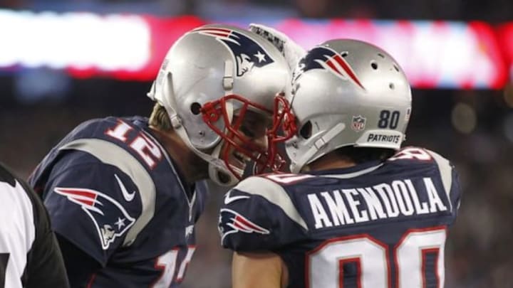 Dec 6, 2015; Foxborough, MA, USA; New England Patriots wide receiver Danny Amendola (80) celebrates with quarterback Tom Brady (12) after scoring a touchdown during the second quarter against the Philadelphia Eagles at Gillette Stadium. Mandatory Credit: Stew Milne-USA TODAY Sports