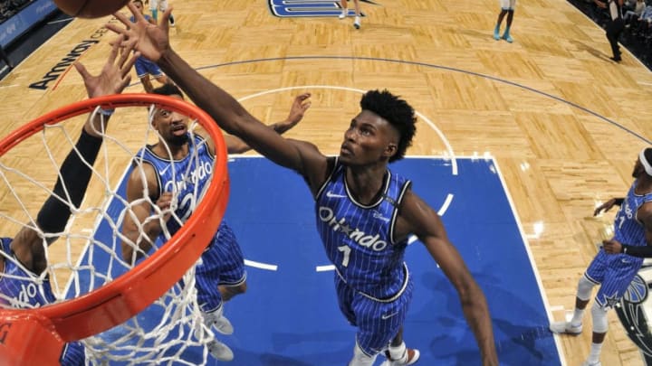 ORLANDO, FL - FEBRUARY 14: Jonathan Isaac #1 of the Orlando Magic rebounds the ball against the Charlotte Hornets on February 14, 2019 at Amway Center in Orlando, Florida. NOTE TO USER: User expressly acknowledges and agrees that, by downloading and/or using this photograph, user is consenting to the terms and conditions of the Getty Images License Agreement. Mandatory Copyright Notice: Copyright 2019 NBAE (Photo by Fernando Medina/NBAE via Getty Images)