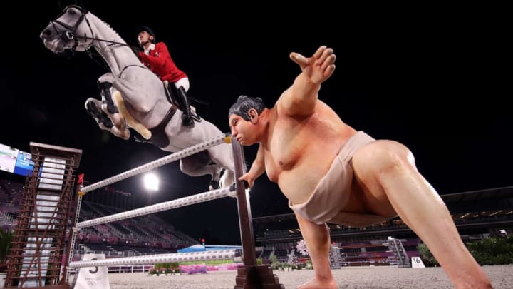 Japanese equestrian Koki Saito competes at the Tokyo Olympics.