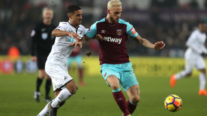 SWANSEA, WALES – MARCH 03: Kyle Naughton of Swansea City and Marko Arnautovic of West Ham United battle for the ball during the Premier League match between Swansea City and West Ham United at Liberty Stadium on March 3, 2018 in Swansea, Wales. (Photo by Christopher Lee/Getty Images)