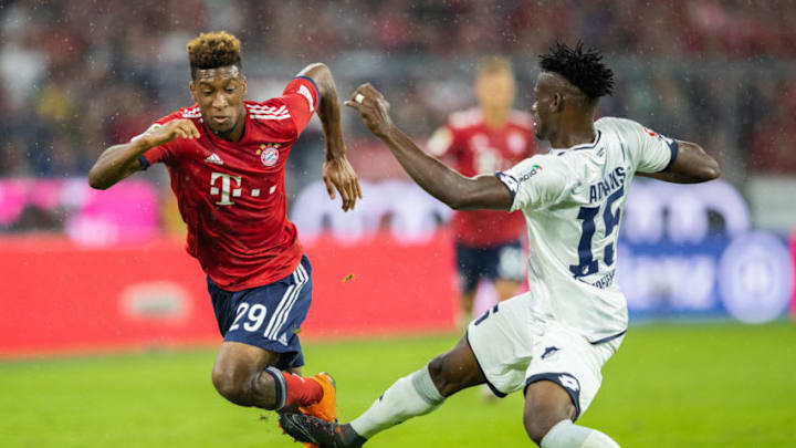 MUNICH, GERMANY - AUGUST 24: Kingsley Coman of FC Bayern Muenchen is challenged by Kasim Adams of TSG Hoffenheim during the Bundesliga match between FC Bayern Muenchen and TSG 1899 Hoffenheim at Allianz Arena on August 24, 2018 in Munich, Germany. (Photo by Boris Streubel/Getty Images)