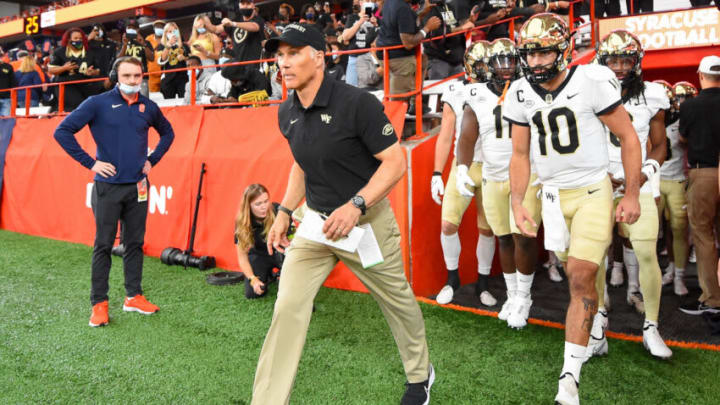 Oct 9, 2021; Syracuse, New York, USA; Wake Forest Demon Deacons head coach Dave Clawson leads his team on the field prior to the game against the Syracuse Orange at the Carrier Dome. Mandatory Credit: Rich Barnes-USA TODAY Sports