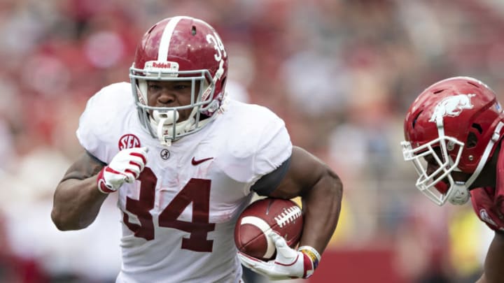 FAYETTEVILLE, AR - OCTOBER 6: Damien Harris #34 of the Alabama Crimson Tide runs the ball in the second half during a game against the Arkansas Razorbacks at Razorback Stadium on October 6, 2018 in Tuscaloosa, Alabamai. The Crimson Tide defeated the Razorbacks 65-31. (Photo by Wesley Hitt/Getty Images)