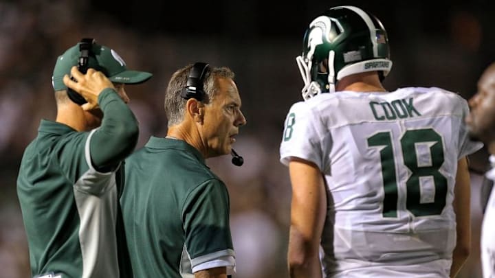 Sep 4, 2015; Kalamazoo, MI, USA; Michigan State Spartans head coach Mark Dantonio talks to quarterback Connor Cook (18) during the 2nd half of a game at Waldo Stadium. Mandatory Credit: Mike Carter-USA TODAY Sports