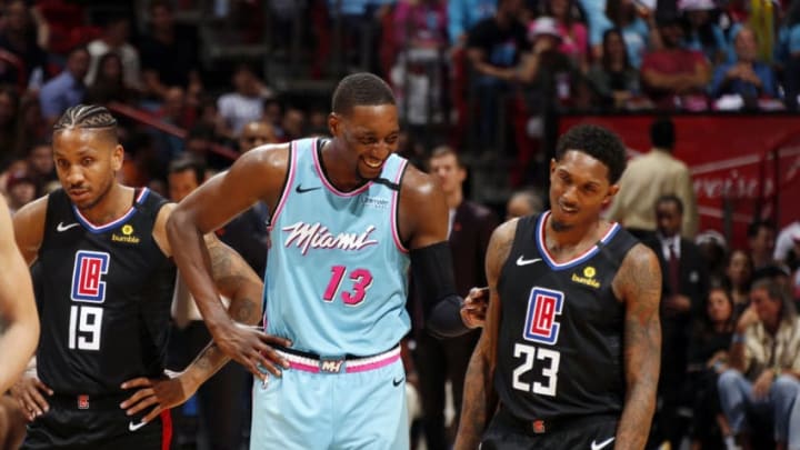 Bam Adebayo #13 of the Miami Heat and Lou Williams #23 of the LA Clippers talk during the game (Photo by Oscar Baldizon/NBAE via Getty Images)