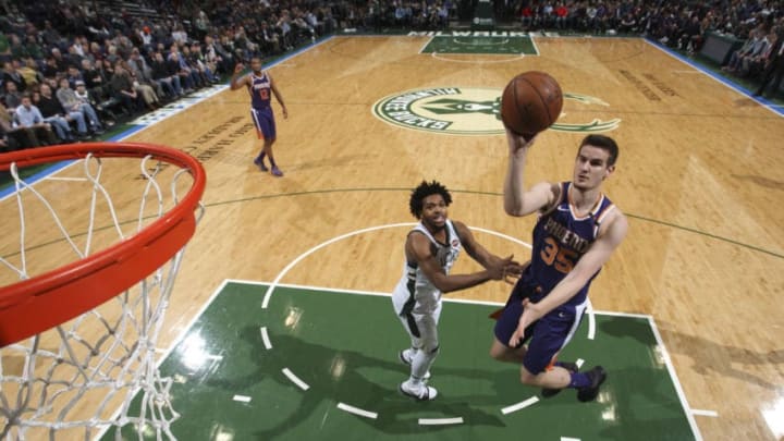 MILWAUKEE, WI - JANUARY 22: Dragan Bender #35 of the Phoenix Suns shoots the ball against the Milwaukee Bucks on January 22, 2018 at the BMO Harris Bradley Center in Milwaukee, Wisconsin. NOTE TO USER: User expressly acknowledges and agrees that, by downloading and or using this Photograph, user is consenting to the terms and conditions of the Getty Images License Agreement. Mandatory Copyright Notice: Copyright 2018 NBAE (Photo by Gary Dineen/NBAE via Getty Images)