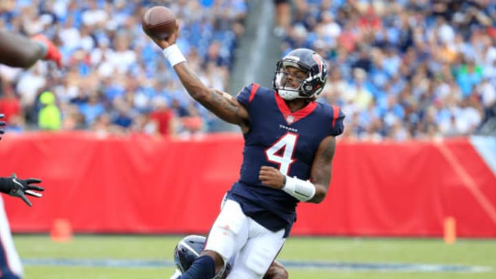 NASHVILLE, TN – SEPTEMBER 16: Deshaun Watson #4 of the Houston Texans throws a pass as he is tackled by Wesley Woodyard #56 of the Tennessee Titans during the third quarter at Nissan Stadium on September 16, 2018 in Nashville, Tennessee. (Photo by Andy Lyons/Getty Images)