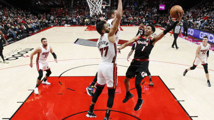 Anfernee Simons # 1 of the Portland Trail Blazers shoots the ball over Omer Yurtseven # 77 and Caleb Martin # 16 of the Miami Heat (Photo by Soobum Im/Getty Images)