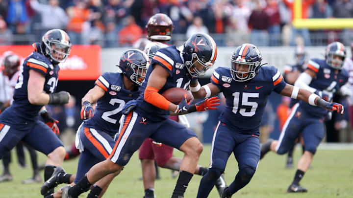CHARLOTTESVILLE, VA - NOVEMBER 29: Noah Taylor #14 of the Virginia Cavaliers makes an interception in the second half during a game against the Virginia Tech Hokies at Scott Stadium on November 29, 2019 in Charlottesville, Virginia. (Photo by Ryan M. Kelly/Getty Images)