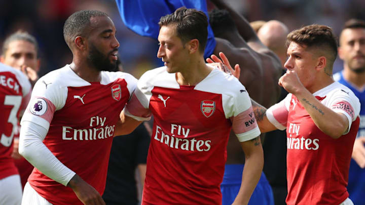 CARDIFF, WALES - SEPTEMBER 02: Alexandre Lacazette, Mesut Ozil and Lucas Torreira of Arsenal celebrate victory after the Premier League match between Cardiff City and Arsenal FC at Cardiff City Stadium on September 2, 2018 in Cardiff, United Kingdom. (Photo by Catherine Ivill/Getty Images)