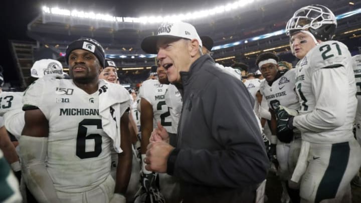 NEW YORK, NY - DECEMBER 27: Head coach Mark Dantonio of the Michigan State Spartans celebrates with his players after defeating the Wake Forest Demon Deacons in the New Era Pinstripe Bowl at Yankee Stadium on December 27, 2019 in the Bronx borough of New York City. Michigan State Spartans won 27-21. (Photo by Adam Hunger/Getty Images)