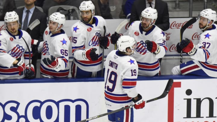 TORONTO, ON - JANUARY 12: C.J. Smith #19 of the Rochester Americans celebrates his goal with teammates against the Rochester Americans during AHL game action on January 12, 2019 at Coca-Cola Coliseum in Toronto, Ontario, Canada. (Photo by Graig Abel/Getty Images)