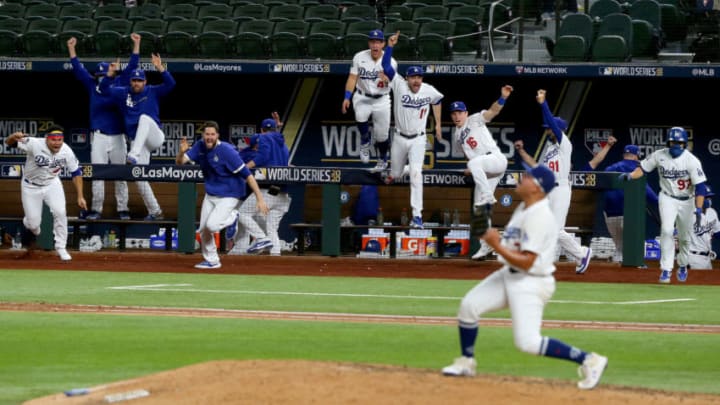 ARLINGTON, TEXAS - OCTOBER 27: The Los Angeles Dodgers celebrate after Julio Urias #7 strikes out Willy Adames (not pictured) of the Tampa Bay Rays to give the Dodgers the 3-1 victory in Game Six to win the 2020 MLB World Series at Globe Life Field on October 27, 2020 in Arlington, Texas. (Photo by Tom Pennington/Getty Images)