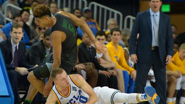 Mar 2, 2016; Los Angeles, CA, USA; UCLA Bruins guard Bryce Alford (20) and Oregon Ducks guard Tyler Dorsey (5) go for a loose ball in the second half of the game at Pauley Pavilion. Oregon won 76-68. Mandatory Credit: Jayne Kamin-Oncea-USA TODAY Sports