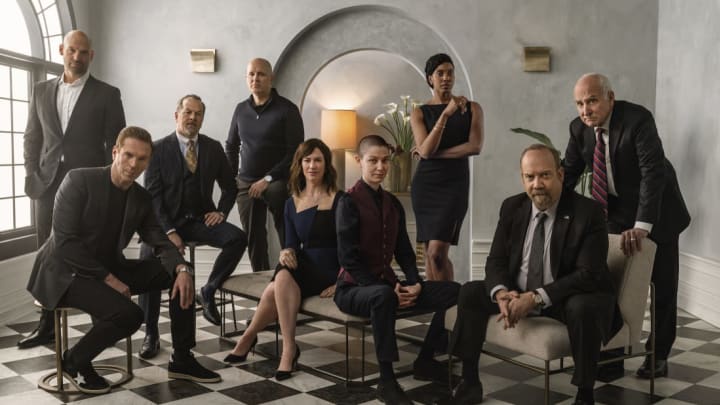 (L-R): Corey Stoll, Damian Lewis, David Costabile, Kelly AuCoin, Maggie Siff, Asia Kate Dillon, Condola Rashad, Paul Giamatti, and Jeffrey DeMunn are at each other's throats in Billions.