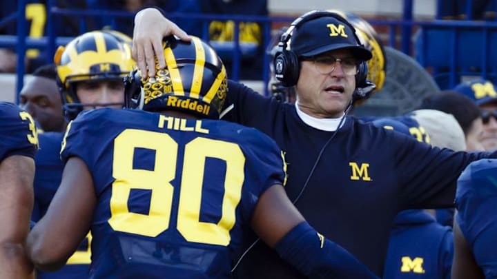 Oct 22, 2016; Ann Arbor, MI, USA; Michigan Wolverines fullback Khalid Hill (80) receives congratulations from head coach Jim Harbaugh after scoring a touchdown in the first half against the Illinois Fighting Illini at Michigan Stadium. Mandatory Credit: Rick Osentoski-USA TODAY Sports