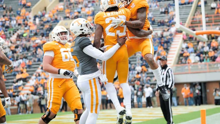 Tennessee running back Jaylen Wright (23) is congratulated by Tennessee quarterback Hendon Hooker (5) and Tennessee wide receiver Velus Jones Jr. (1) on a touchdown at the Orange & White spring game at Neyland Stadium in Knoxville, Tenn. on Saturday, April 24, 2021.Kns Vols Spring Game