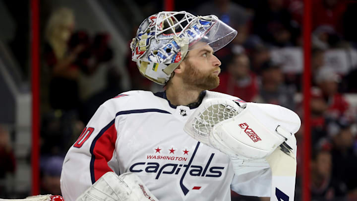 RALEIGH, NC – APRIL 15: Braden Holtby #70 of the Washington Capitals watches a replay on the video board against the Carolina Hurricanes during a stop in play in Game Three of the Eastern Conference First Round during the 2019 NHL Stanley Cup Playoffs on April 15, 2019 at PNC Arena in Raleigh, North Carolina. (Photo by Gregg Forwerck/NHLI via Getty Images)