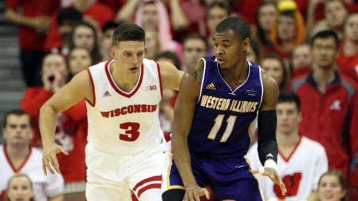 Nov 13, 2015; Madison, WI, USA; Western Illinois Leathernecks guard Delo Bruster looks to pass as Wisconsin Badgers guard Zak Showalter (3) defends at the Kohl Center. Western Illinois defeated Wisconsin 69-67. Mandatory Credit: Mary Langenfeld-USA TODAY Sports