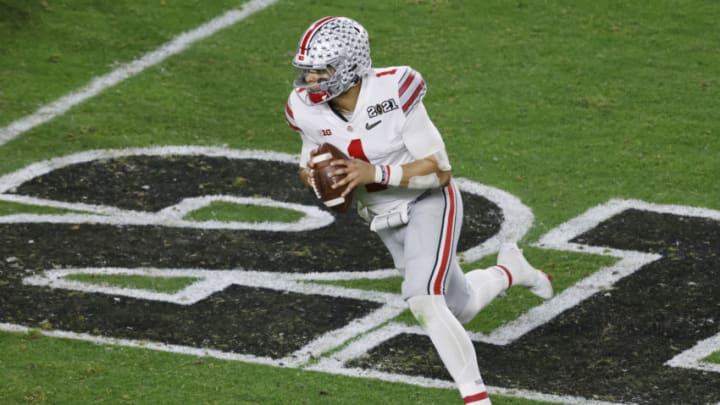 MIAMI GARDENS, FLORIDA - JANUARY 11: Justin Fields #1 of the Ohio State Buckeyes scrambles during the fourth quarter of the College Football Playoff National Championship game against the Alabama Crimson Tide at Hard Rock Stadium on January 11, 2021 in Miami Gardens, Florida. (Photo by Michael Reaves/Getty Images)
