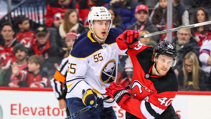 NEWARK, NJ - DECEMBER 29: Buffalo Sabres defenseman Rasmus Ristolainen (55) battles New Jersey Devils center Blake Coleman (40) during the first period of the National Hockey League Game between the New Jersey Devils and the Buffalo Sabres on December 29, 2017, at the Prudential Center in Newark, NJ. (Photo by Rich Graessle/Icon Sportswire via Getty Images)