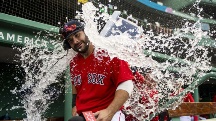 BOSTON, MA - AUGUST 9: Mitch Moreland #18 of the Boston Red Sox is doused with water after hitting a game winning walk-off two run home run during the ninth inning of a game against the Toronto Blue Jays on August 9, 2020 at Fenway Park in Boston, Massachusetts. It was his second home run of the day. The 2020 season had been postponed since March due to the COVID-19 pandemic. (Photo by Billie Weiss/Boston Red Sox/Getty Images)