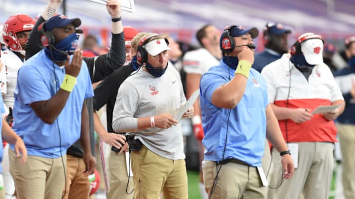Oct 17, 2020; Syracuse, NY, USA; Liberty coach Hugh Freeze (middle) in the second half during a game against Syracuse on Saturday, Oct. 17, 2020, at the Carrier Dome in Syracuse, N.Y. Mandatory Credit: Dennis Nett/Pool Photo-USA TODAY Sports