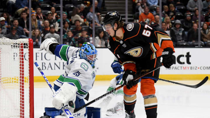 ANAHEIM, CALIFORNIA - NOVEMBER 01: Jacob Markstrom #25 of the Vancouver Canucks makes a save on Rickard Rakell #67 of the Anaheim Ducks during the third period in a 2-1 overtime Ducks win at Honda Center on November 01, 2019 in Anaheim, California. (Photo by Harry How/Getty Images)