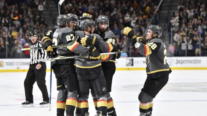 LAS VEGAS, NEVADA - FEBRUARY 08: Cody Eakin #21 of the Vegas Golden Knights celebrates with teammates after scoring a goal during the third period against the Carolina Hurricanes at T-Mobile Arena on February 08, 2020 in Las Vegas, Nevada. (Photo by Jeff Bottari/NHLI via Getty Images)