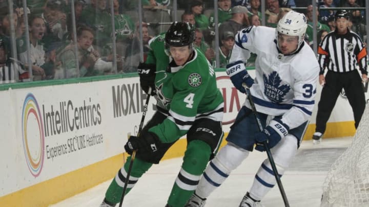DALLAS, TX - OCTOBER 9: Miro Heiskanen #4 of the Dallas Stars tries to keep the puck away against Auston Matthews #34 of the Toronto Maple Leafs at the American Airlines Center on October 9, 2018 in Dallas, Texas. (Photo by Glenn James/NHLI via Getty Images)