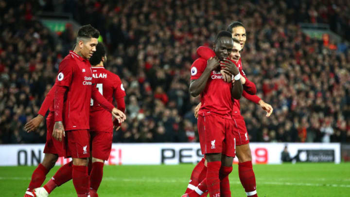 LIVERPOOL, ENGLAND - DECEMBER 29: Sadio Mane of Liverpool celebrates with team mates after scoring his sides third goal during the Premier League match between Liverpool FC and Arsenal FC at Anfield on December 29, 2018 in Liverpool, United Kingdom. (Photo by Clive Brunskill/Getty Images)