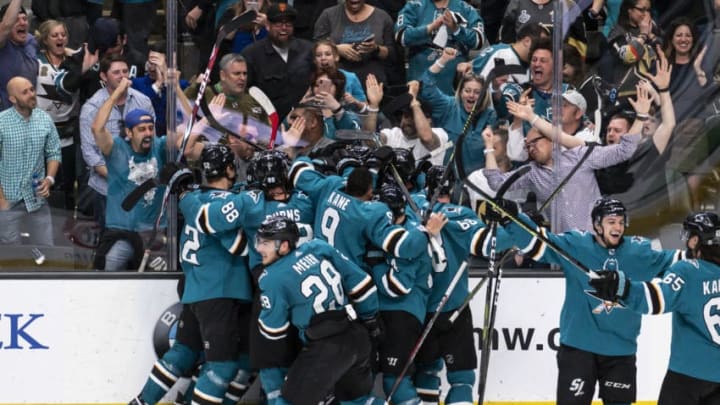 SAN JOSE, CA - APRIL 23: The San Jose Sharks team piles on San Jose Sharks right wing Barclay Goodrow (23) celebrating the win in Game 7, Round 1 between the Vegas Golden Knights and the San Jose Sharks on Tuesday, April 23, 2019 at the SAP Center, San Jose, CA. (Photo by Douglas Stringer/Icon Sportswire via Getty Images)