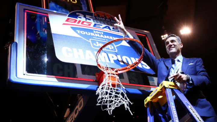 NEW YORK, NY - MARCH 11: Head coach Jay Wright of the Villanova Wildcats cuts a piece of the net after defeating the Creighton Bluejays to win the Big East Basketball Tournament - Championship Game at Madison Square Garden on March 11, 2017 in New York City. (Photo by Mike Stobe/Getty Images)