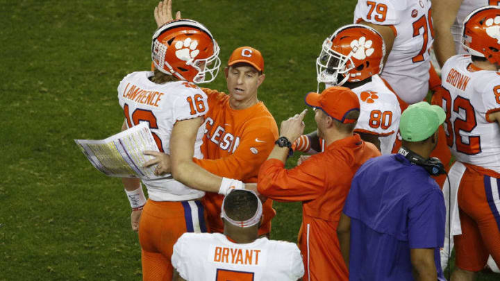 SANTA CLARA, CALIFORNIA - JANUARY 07: Trevor Lawrence #16 of the Clemson Tigers celebrates with head coach Dabo Swinney against the Alabama Crimson Tide during the fourth quarter in the College Football Playoff National Championship at Levi's Stadium on January 07, 2019 in Santa Clara, California. (Photo by Lachlan Cunningham/Getty Images)