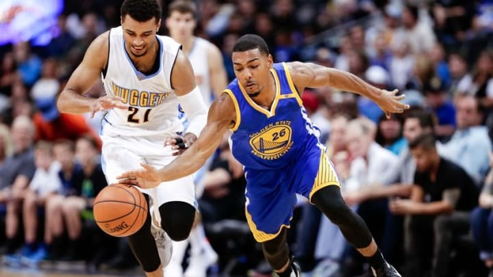 Oct 14, 2016; Denver, CO, USA; Golden State Warriors guard Phil Pressey (26) and Denver Nuggets guard Jamal Murray (27) battle for the ball in overtime at the Pepsi Center. The Warriors won 129-128. Mandatory Credit: Isaiah J. Downing-USA TODAY Sports